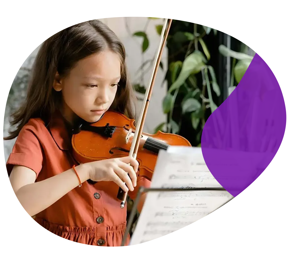 A small girl learning violin with notes