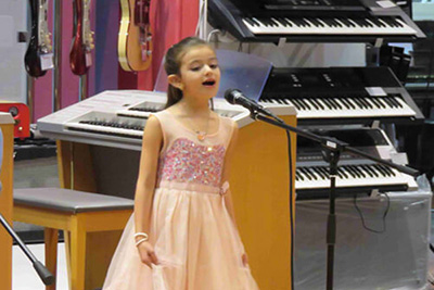 A kid playing Guitar